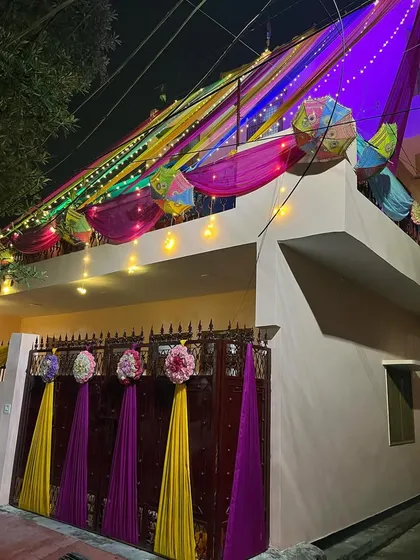 Another angle of the decorated home exterior, showing the details on the main gate.