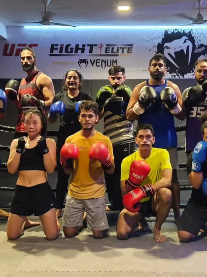 The elite batch, a mix of experienced male and female fighters, ready for another session. We foster an environment where everyone trains hard and supports each other.