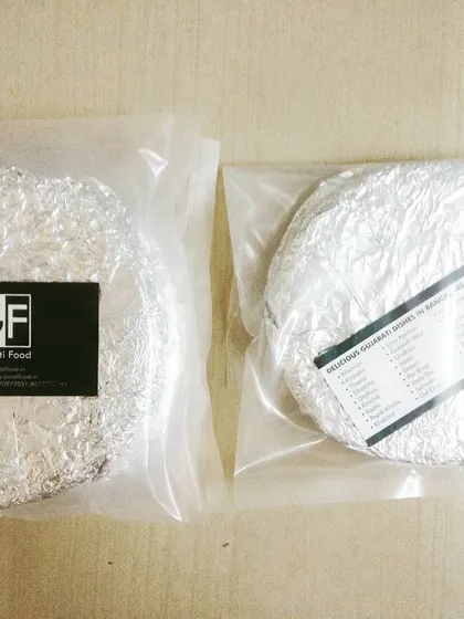 Your food is always packed fresh to maintain its warmth and taste. Here are stacks of Methi Thepla, wrapped securely in foil and ready for delivery, ensuring they reach you in perfect condition.