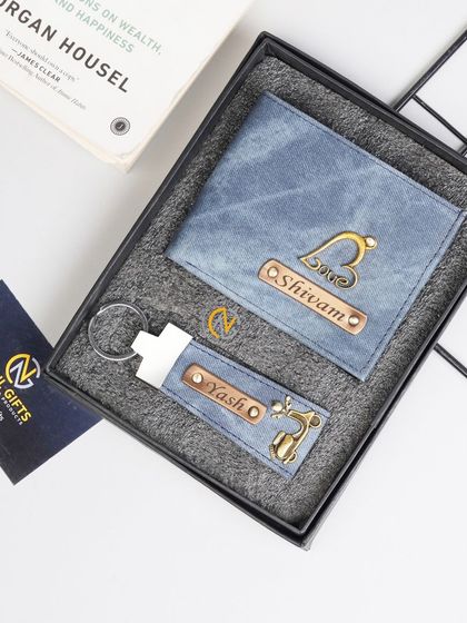 A blue denim wallet and keychain combo, personalized with 'love' and deer charms.