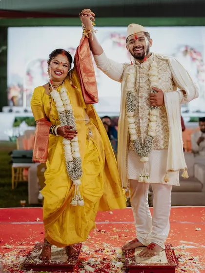 A celebratory moment between the bride and groom after their wedding rituals.
