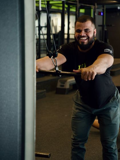Coach Vinay taking a break from a set. He's our go-to expert for strength building, Olympic weightlifting, and mobility training.