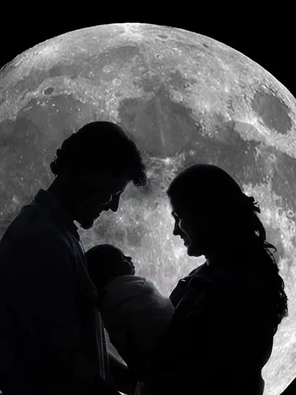 A beautiful silhouette portrait of parents and their newborn against a digitally created full moon, highlighting their new bond as a family.