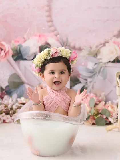Our milk bath sessions are a unique and gentle way to capture your baby's milestones. We use safe, warm, milky water and fresh flowers for these serene and beautiful portraits.