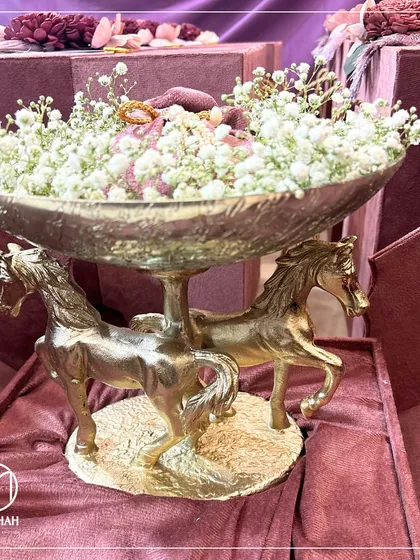 Our Double Horse Bowl is a masterpiece of grace and power, designed to be an unforgettable centerpiece. The two intricately sculpted horses support a hammered metal bowl, creating a sense of grandeur. It is presented here in a custom velvet box, ready to become a treasured family heirloom.