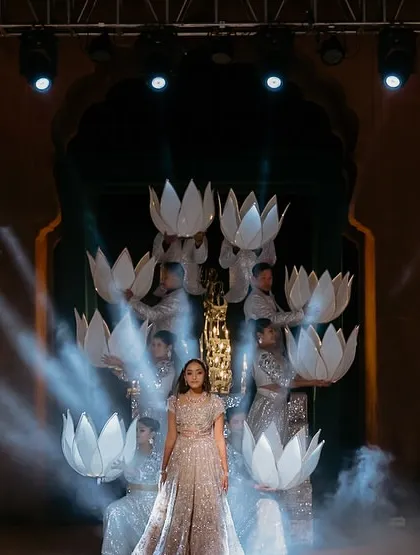 A bride's solo performance should be nothing short of magical. We conceptualized this act with lotus props that opened up to reveal the bride, complemented by cold pyros and dramatic smoke to create a moment of pure grace and beauty.