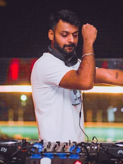 Letting the music move me. A candid shot of me dancing behind the console.