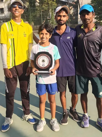 A young player with his coaches after a runner-up finish in an Under-10 tournament in Aurangabad. Every final is a step on the journey.