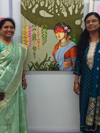 Standing with a visitor in front of my painting at my last art exhibition of the year.