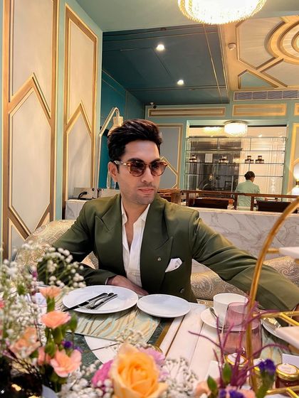 The bottle green blazer, styled for a sophisticated brunch. Its versatility makes it a valuable addition to any gentleman's wardrobe.