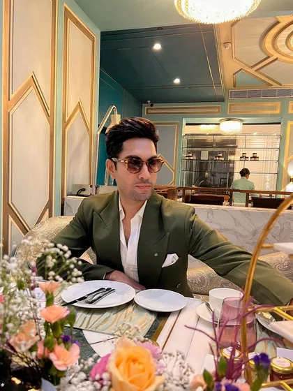 The bottle green blazer, styled for a sophisticated brunch. Its versatility makes it a valuable addition to any gentleman's wardrobe.