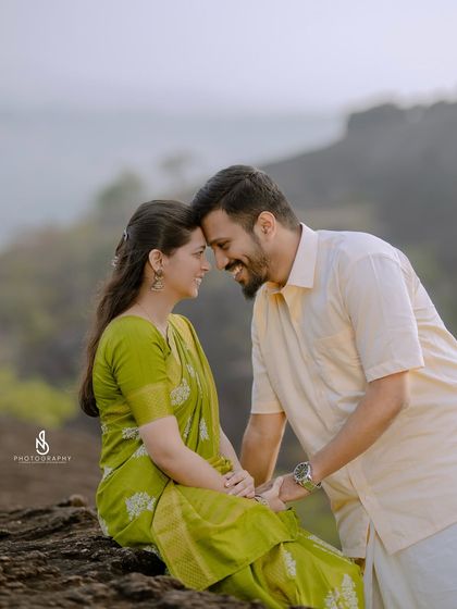 An intimate and happy moment, nose-to-nose. The genuine smiles are what make this pre-wedding photo so heartwarming.