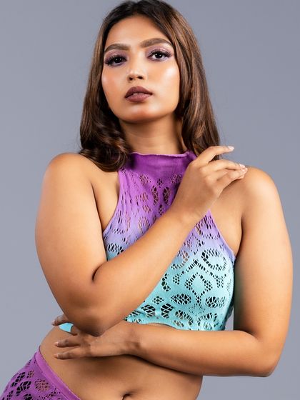 A close-up portrait of the model in the ombre lace top, focusing on her expression.