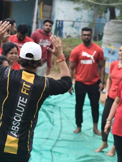 Instructing a group during a wellness retreat. Clear guidance and positive energy are key to a successful group session.