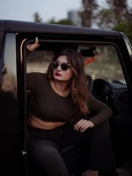 A duplicate of image 488, this moody portrait of a model in a car at dusk is cinematic and intriguing.