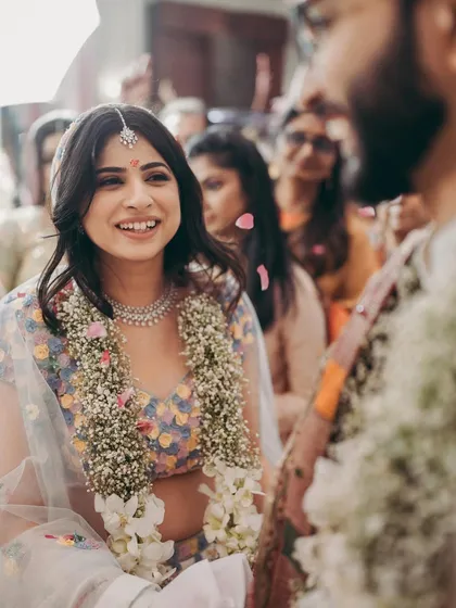 A candid shot showing the bride's genuine smile, a testament to feeling comfortable and beautiful in her own skin.