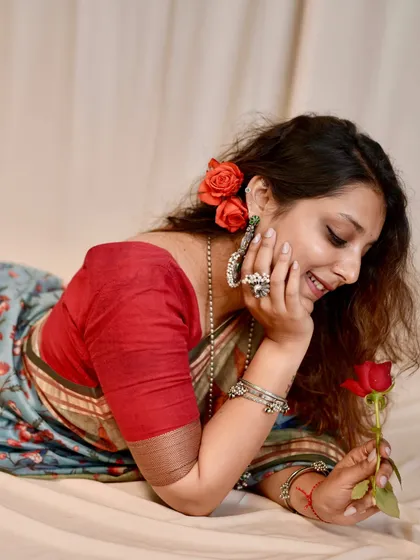 A romantic, dreamy shot from my personal saree photoshoot, using a single rose as a simple, elegant prop.