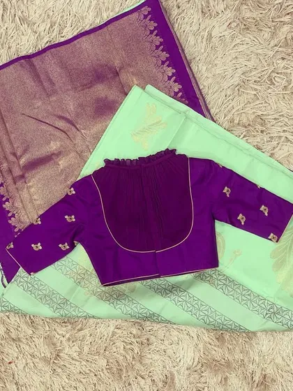 Another view of the violet blouse and bay green saree, a sophisticated and unique color combination.