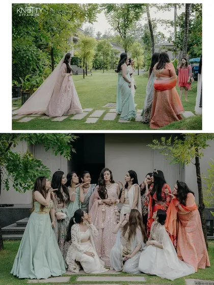 The bride with her squad of bridesmaids, posing for fun and elegant group photos in a beautiful garden setting.