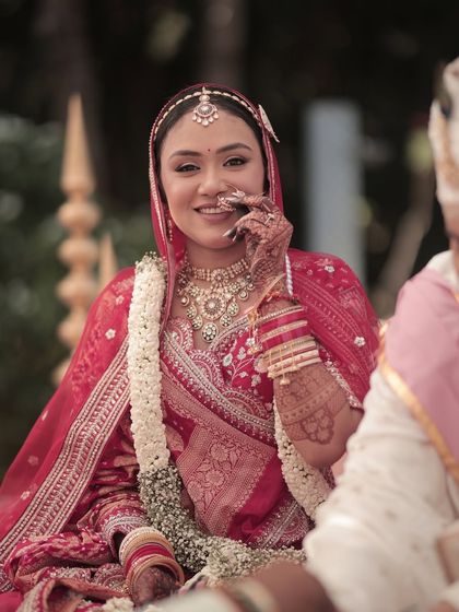 A happy, candid moment during the ceremony. Her makeup is designed to be long-lasting, ensuring she looks fresh and beautiful throughout the festivities.