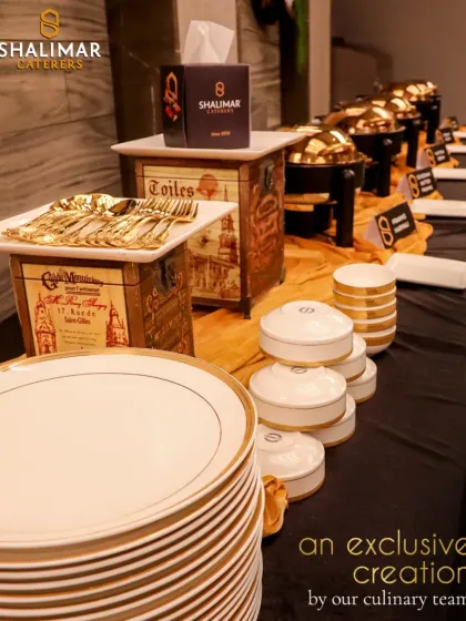 An exclusive creation by our culinary team. This setup highlights our attention to branding and detail, with custom tissue boxes and high-end chafing dishes that maintain the premium feel of your event.