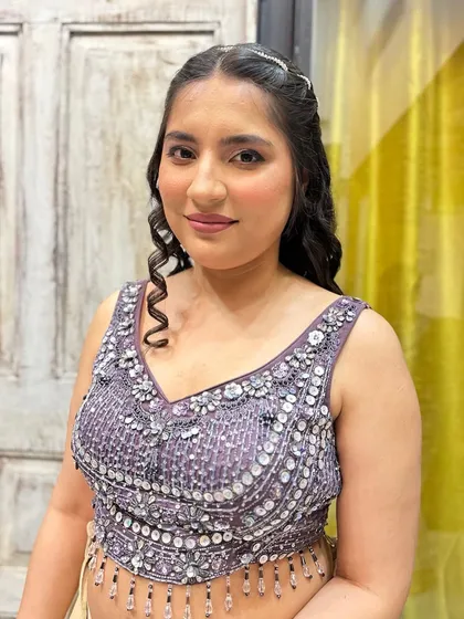 A soft and pretty look for a cousin's wedding. The makeup is kept minimal and fresh, with soft curls and a delicate hair accessory to complete the look.