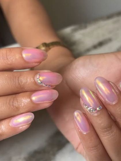 A close-up shot showing the beautiful color shift in this pink and gold iridescent chrome. The added rhinestones provide a perfect touch of sparkle.