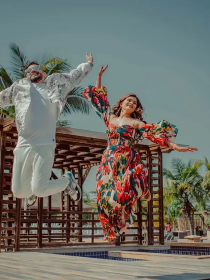 A joyful jump shot of one of the couples at their pool party. We capture the fun and carefree spirit of the celebration.