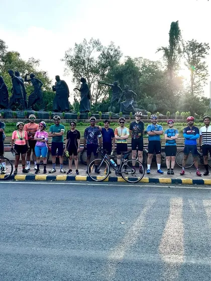 The whole group posing in front of the Gyarah Murti sculpture, a common landmark on our routes.