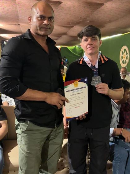 With my student Sonia Dhaka as she receives her silver medal and certificate. I am proud of her performance and determination.