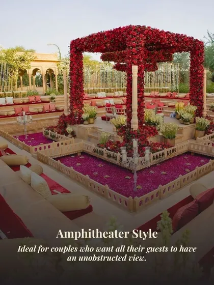 This amphitheater-style seating in Rajasthan ensures every guest has a perfect, unobstructed view of the central mandap. The structure is covered in crimson florals, creating a dramatic and royal atmosphere.