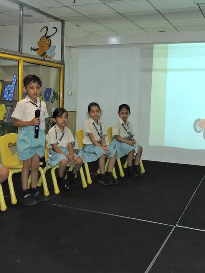 Taking turns at the microphone, students build their confidence and language skills. Our Buzzathon competition is a testament to our focus on creating articulate and self-assured communicators.