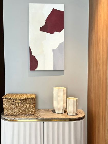 A minimalist abstract painting with blocks of white, grey, and deep red. This piece was part of a larger commission for a home in Hyderabad.