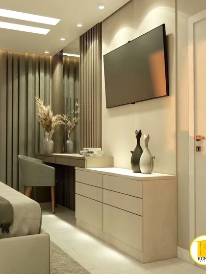 A close-up of the TV and dressing table area in a luxurious bedroom. The design uses a consistent color palette to create a cohesive look.