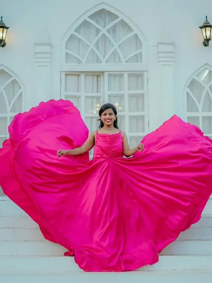 A joyful solo portrait of the bride-to-be. Priyanka's vibrant pink gown creates a stunning heart shape as she twirls, a perfect fairytale moment.