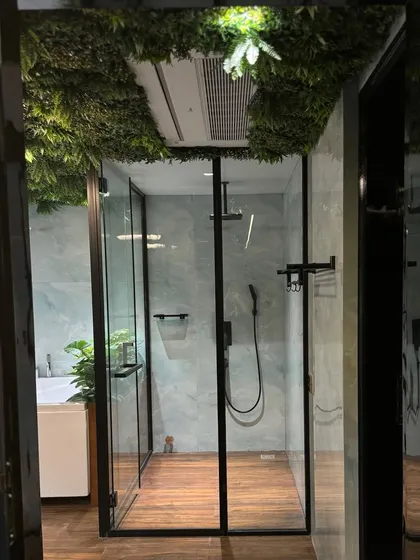 Luxury in the lap of nature. This serene bathroom features a unique artificial grass ceiling, creating the feeling of showering in a private, open-air oasis.