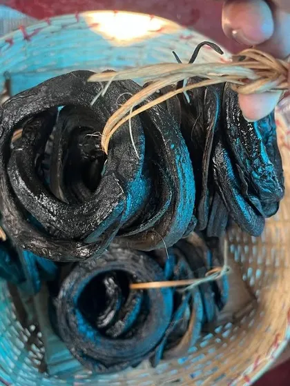 Coils of dried smoked eel, a delicacy in Nagaland, showcasing the traditional methods of food preservation.