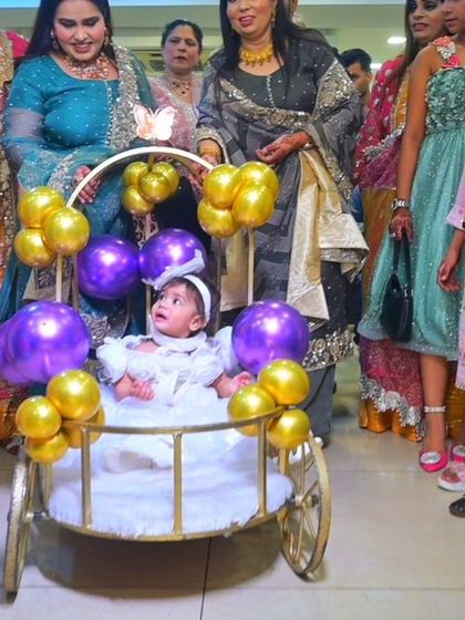 A wider view of the grand entrance, with family and friends looking on as the birthday girl arrives. I capture not just the main subject, but the reactions of the guests as well.