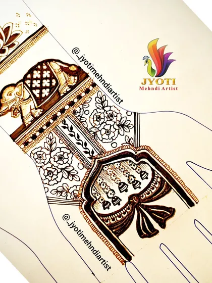 A practice design on a hand template showing an elephant motif as part of a larger bridal pattern.