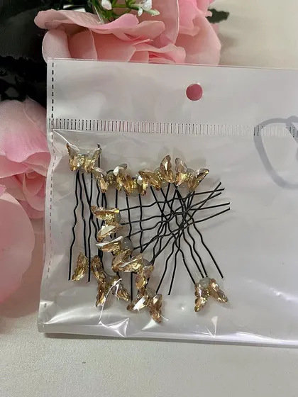 The gold crystal butterfly U-pins are perfect for a traditional look with a touch of modern glam.