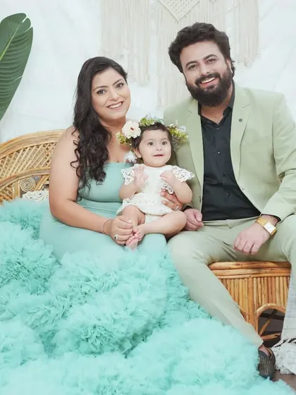 A stylish family portrait featuring one of our flowing client gowns for mom. We help you coordinate outfits for a polished and beautiful final image.