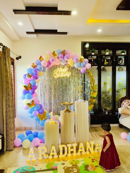 The birthday girl exploring her beautiful butterfly themed party setup. My decorations are designed to be a magical playground for the little ones on their special day.