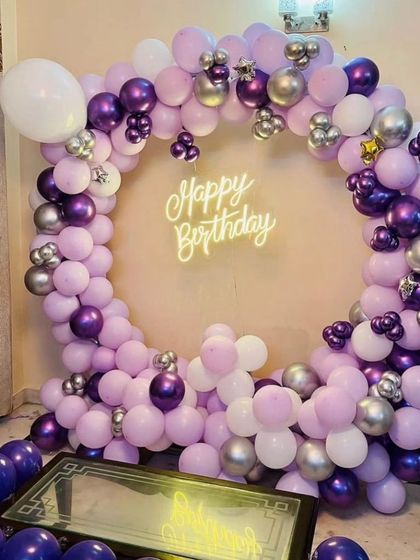 A gorgeous balloon ring in shades of lavender, chrome purple, and silver. This is a great example of a sophisticated color palette for a birthday celebration.