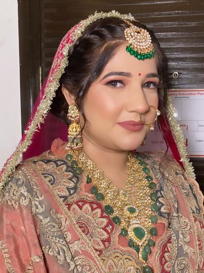 A close-up of my beautiful Punjabi bride, Kartika. Her skin is glowing, and the makeup is subtle enough to let her traditional jewelry shine.