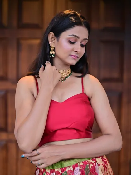 A pensive look downwards, showing off the subtle and beautifully blended eyeshadow. This is a great example of a soft glam look perfect for photoshoots.