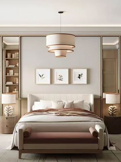 An elegant bedroom design with a classic-meets-modern aesthetic. It features mirrored wardrobe panels flanking the bed, a stylish tiered chandelier, and a dedicated vanity area, creating a bright and sophisticated space.
