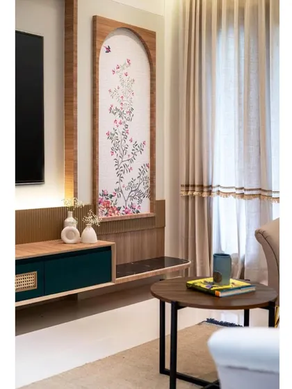 A wider view of the TV unit, showing how the artwork, console, and decor come together to create a balanced and beautiful composition.