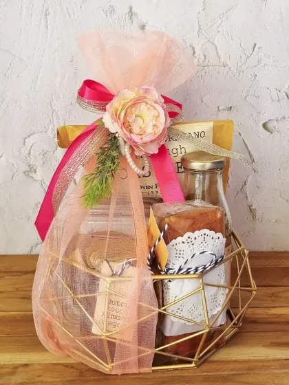 Celebrate with a touch of elegance. This golden geometric basket is filled with gourmet treats and makes for a very modern and sophisticated gift.