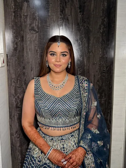 My bride Nain, looking gorgeous for her engagement. She wore a stunning navy blue lehenga, and we created a beautiful smokey eye with silver glitter to match the intricate work on her outfit.
