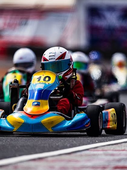 Our Micro driver in the number 10 kart, leading a pack of racers.